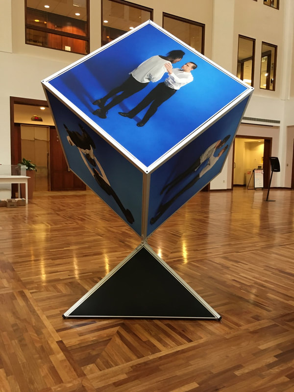 Noted fine art photographer and sculpture artist David Lee Black collaborates with Vermont fine art painter Matthew J. Peake with the Outside the Box Project involving an 8 ' tall cube showing six sides of the human forms. 