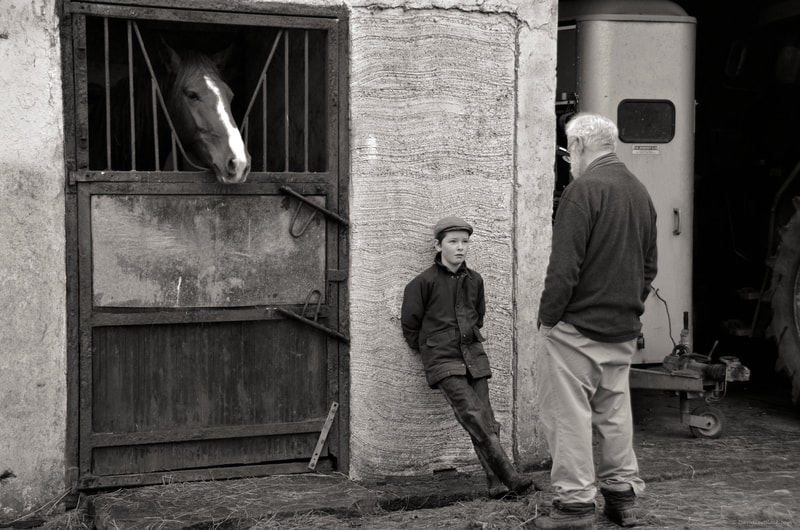 "The Listeners"
16 x 20”
.
.
The Leahy horse farm in Lahinch of western Ireland is a delightful destination to photograph life as it happens in real-time. The Leahy boys are hard working and always eager to lend a hand, or ear in this case... listening intently along with his horse companion, to the musings of the late great David Lang.