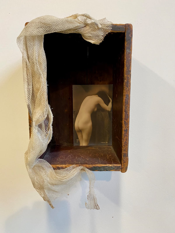 Noted Boston sculpture artist David Lee Black creates assemblage with vintage French porn postcards collectible with vintage wooden box and antique Belgium Lace. 