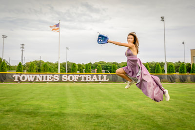  Fine art photographer David Lee Black with model with purple dress playing softball catching ball with american flag. 