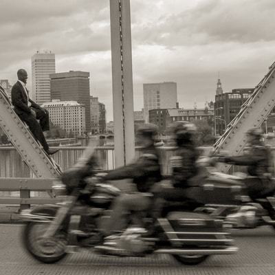 Sidy Maiga photographed by fine art photographer David Lee Black at Wichendon Bridge, Providence, Rhode Island with motorcycles. 