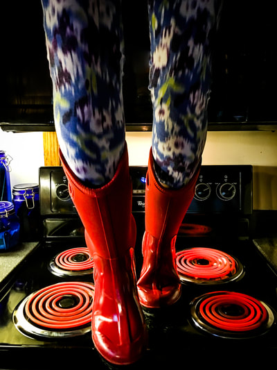 fine art photographer David Lee Black Wandress, cancer survivor walking on hot stove with Bog boots and psychedelic yoga pants. 