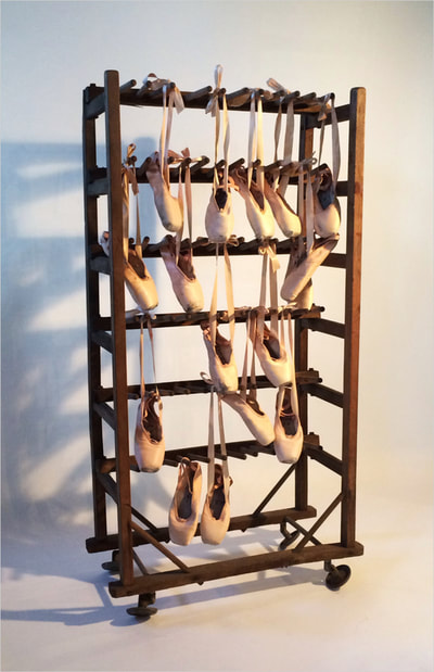 Noted Boston sculpture artist David Lee Black creates assemblage with pointe shoes from Island Moving Company, Newport's contemporary ballet company with a pre-civil war shoe drying rack "Silently and Light of Foot."