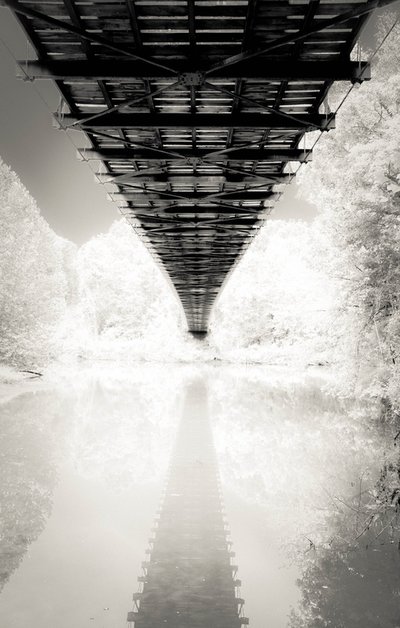 Fine art photographer David Lee Black with his black and white photograph of a Missouri pre-civil war bridge in infrared journey and destination. 
